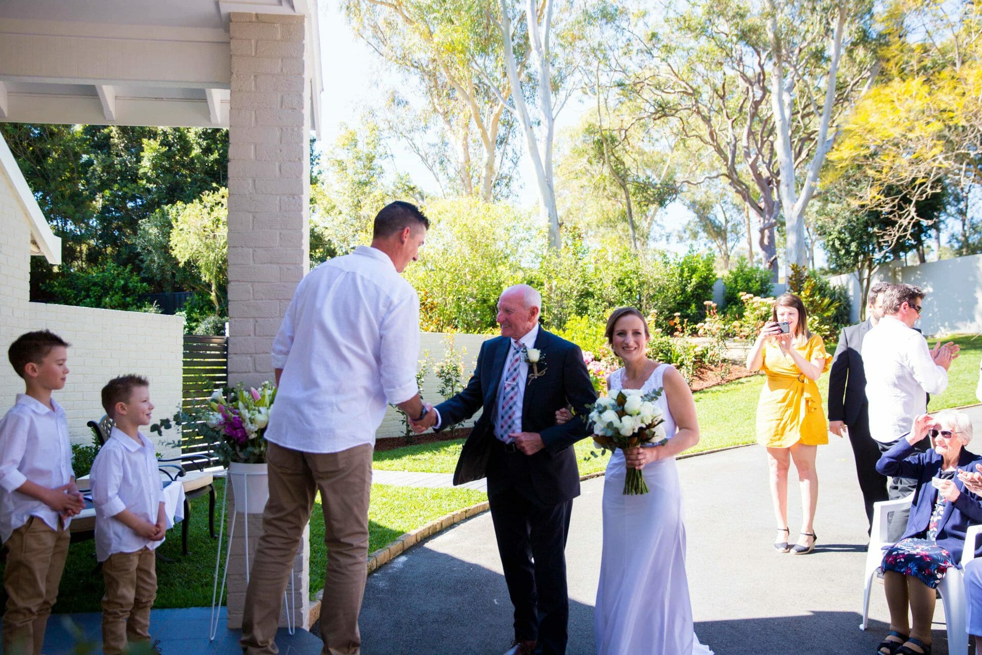 walking down the aisle Marriage ceremony with bride and groom at Whitebridge NSW