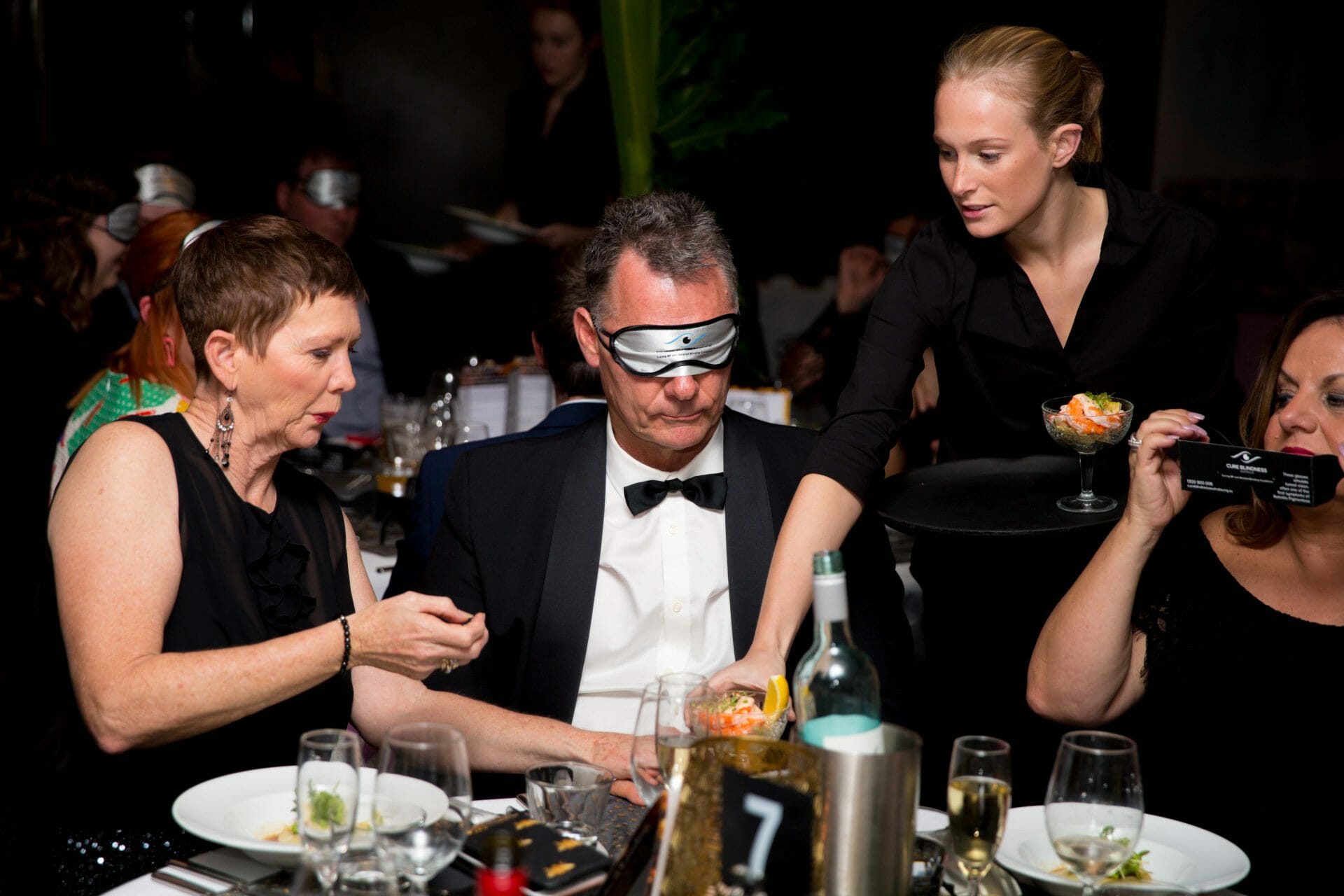 Eating dinner at Cure Blindness Australia charity event
