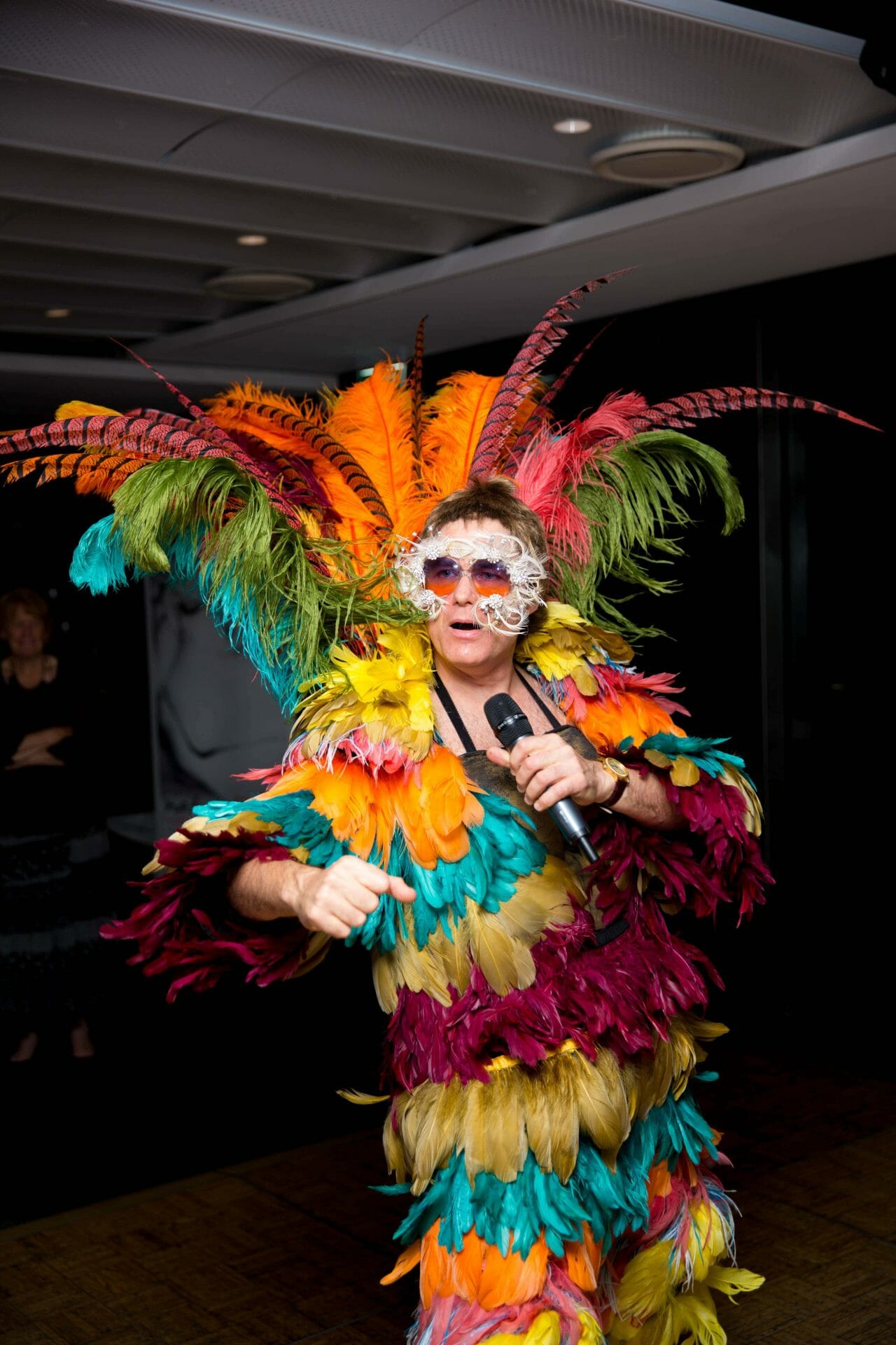 Elvis sining and dancing for charity event at Merewether Surf house
